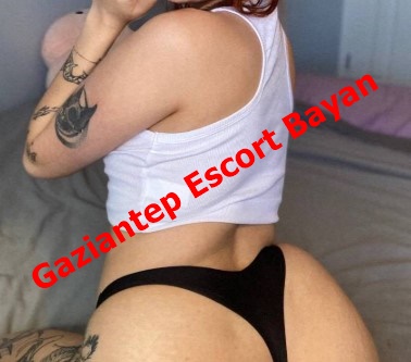 Advertisement image showing a woman in a white crop top and black thong posing on a bed, with red text 'Gaziantep Escort Bayan' across. Advertisement image showing a woman in a white crop top and black thong posing on a bed, with red text 'Gaziantep Escort Bayan' across.